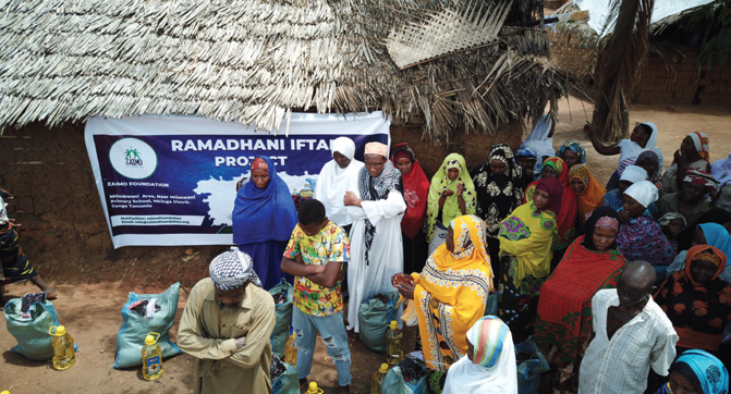 Aisha from Pemba receiving food assistance